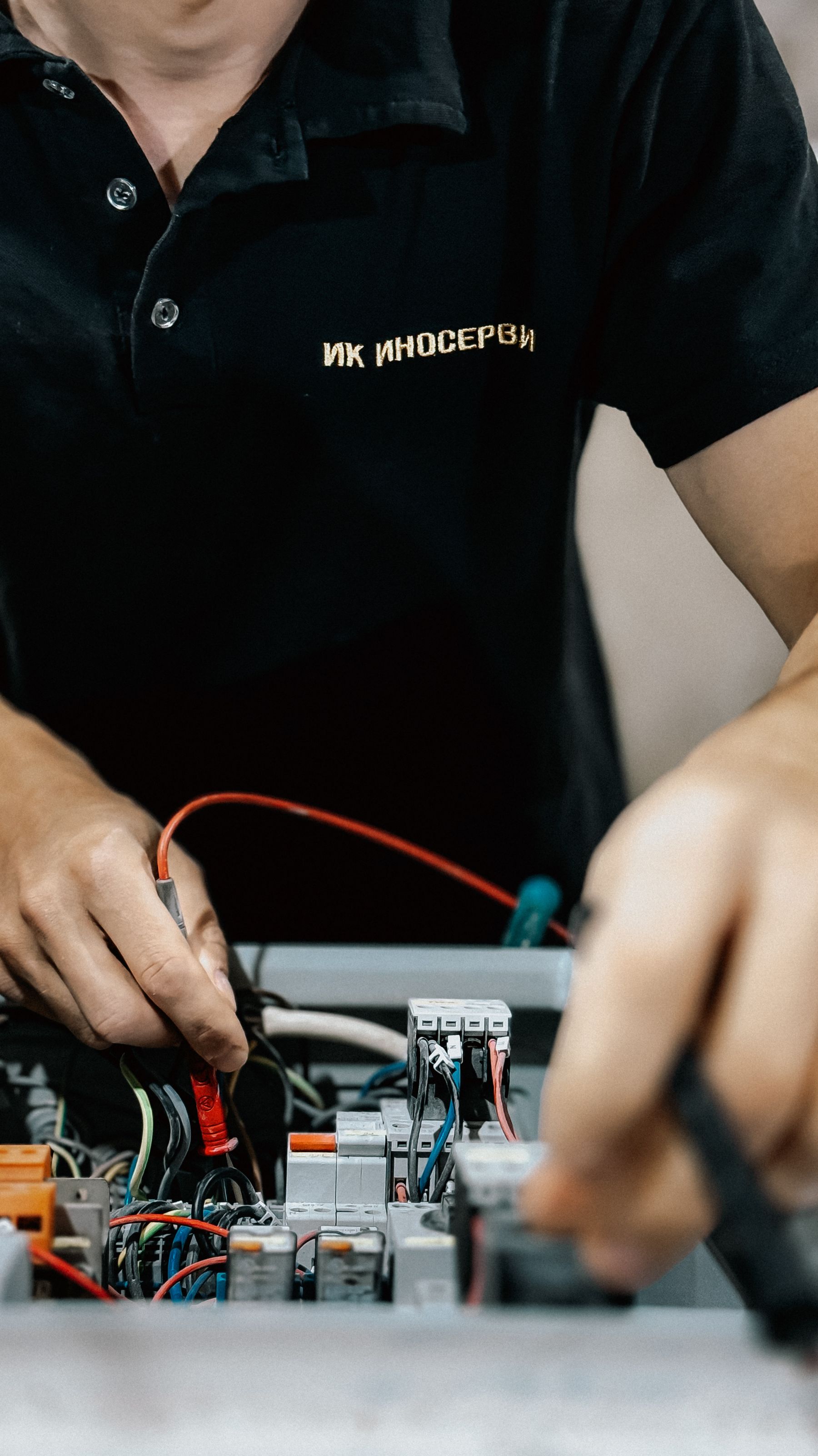 Electrician working on an electrical panel